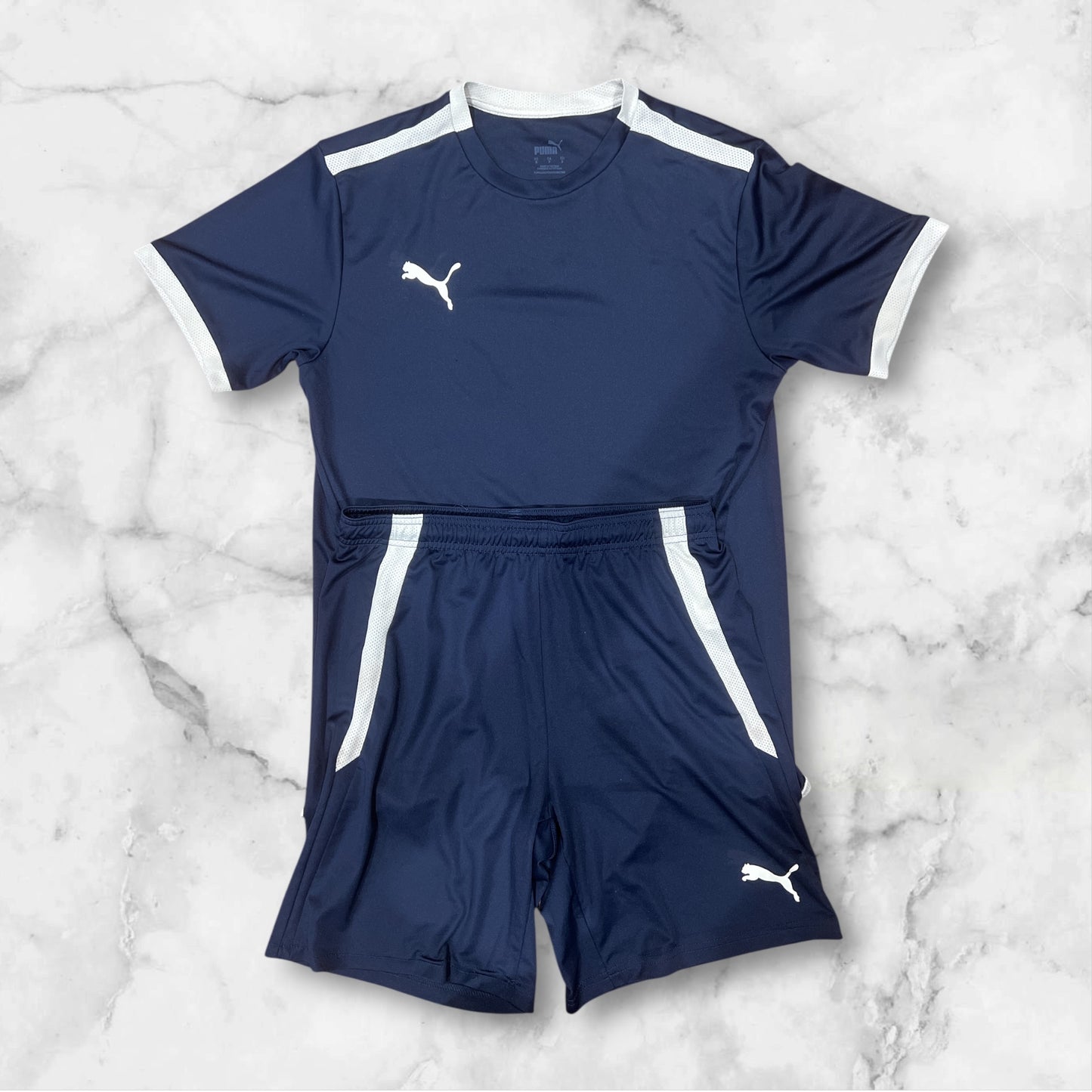 Conjunto deportivo Puma manga corta shorts